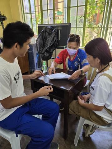 A photograph from an ARMS outreach.