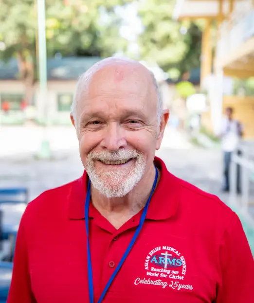 Pastor Glenn Kennedy in a red ARMS shirt